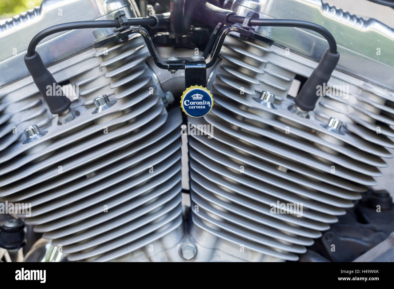 Harley Davidson engine with Coronitas bottle top decoration on bracket Stock Image