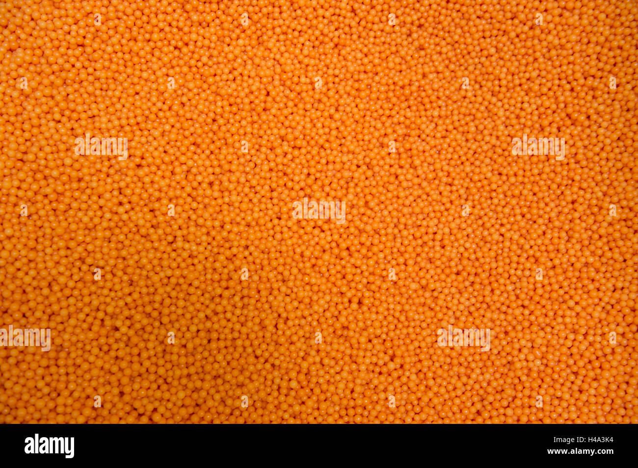 Gorlitz, Germany. 20th Sep, 2016. Orange love pearls can be seen in the sweets factory of Rudolf Hoinkis GmbH in Gorlitz, Germany, 20 September 2016. The sweets factory was founded on 16 August 1896 by Rudolf Hoinkis, the grandfather of nowadays' factory owner, Matthias Hoinkis. The business owes its worldwide publicity to the invention of the 'love pearl'. PHOTO: ARNO BURGI/dpa/Alamy Live News Stock Photo