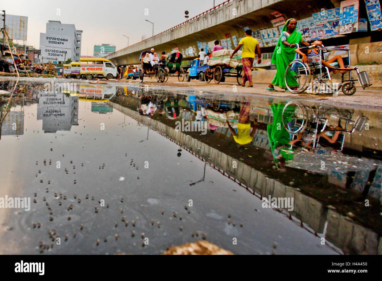 Dhaka, Bangladesh. 13th Oct, 2016. Without decent sewerage system. Dhaka is a metropolitan city without decent sewerage system, sewerage system is so poor that it always over flows and flooded the streets. This filthy water is safe house for mosquitoes and debases. © AR Sumon/ZUMA Wire/ZUMAPRESS.com/Alamy Live News Stock Photo