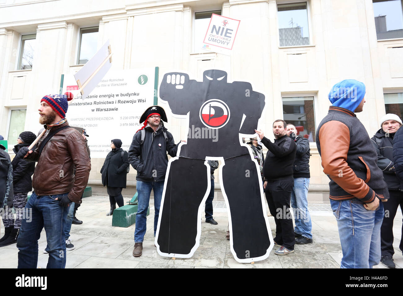 Poland, Warsaw, 15th October 2016: Several NGOs, Green Party, Antifa and Solidarnosc (labour union) held protest march against TTIP and CETA at the Ministry of Agriculture in Poland. Credit: Madeleine Ratz/Alamy Live News Stock Photo