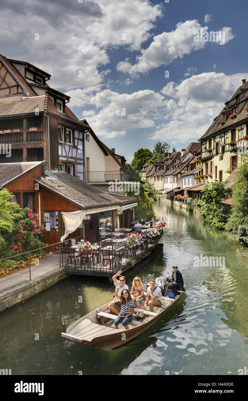 France, Alsace, Colmar, River, boat, waving people, Stock Photo