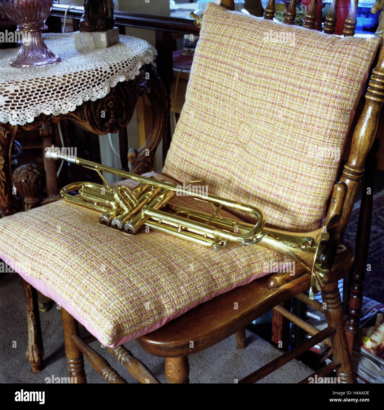 Trumpet on old chair Stock Photo Alamy