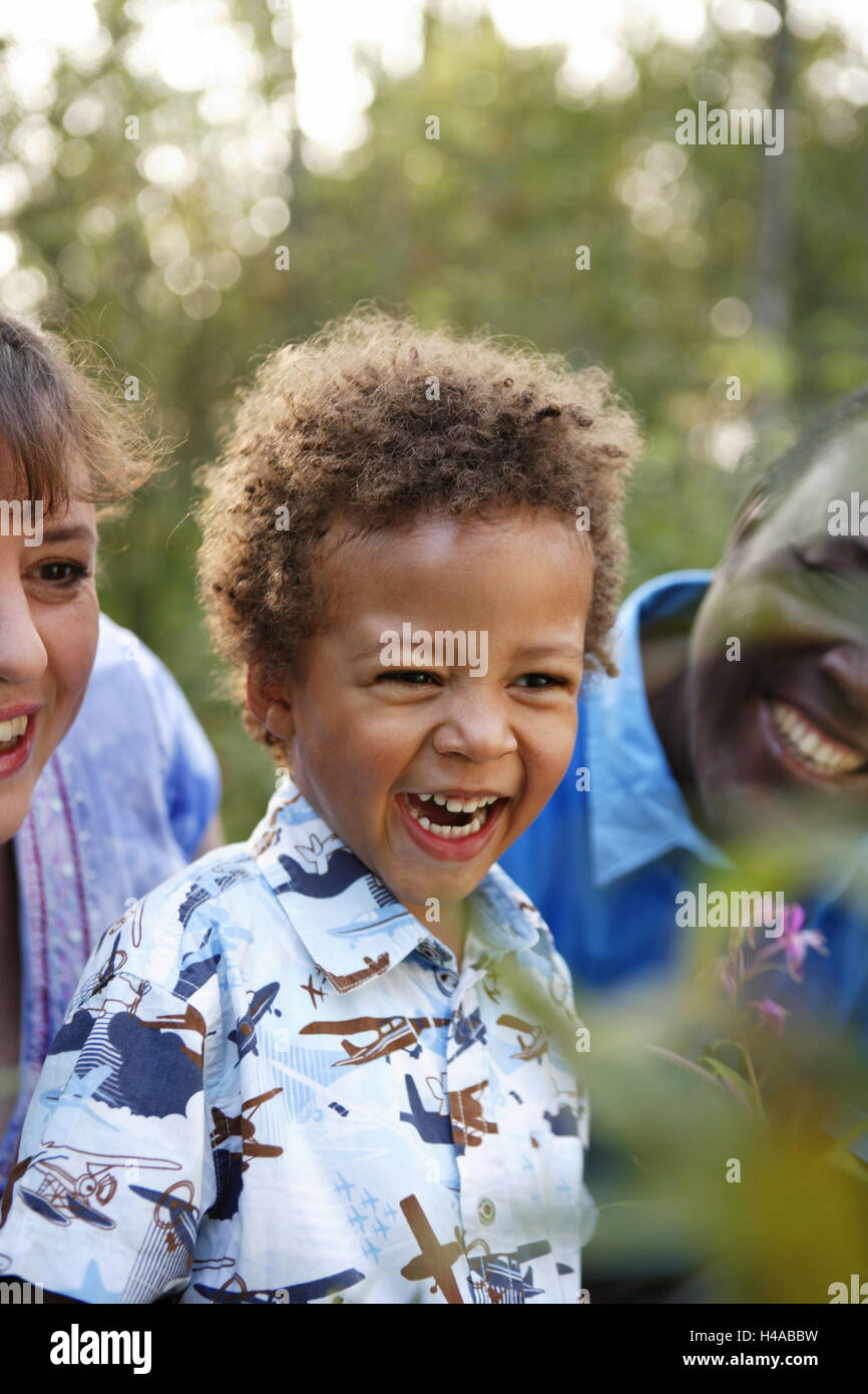 Family laugh in the wood, happily, medium close-up, Stock Photo