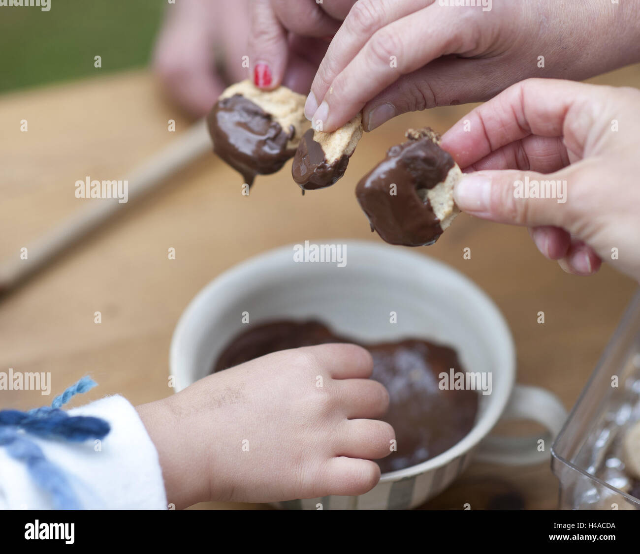 Women, child, little place bake, dive into chocolate, medium close-up, detail, Stock Photo