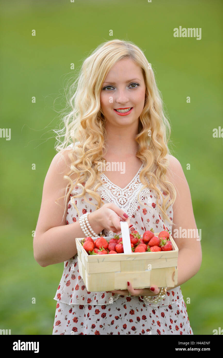 Young woman on a strawberry field Stock Photo - Alamy