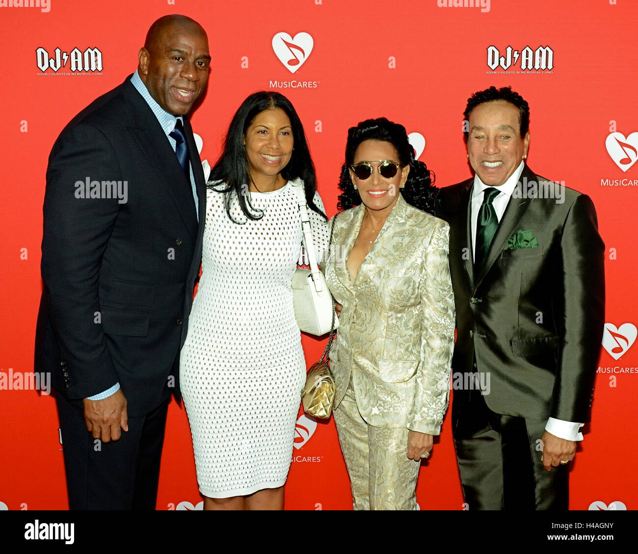 Magic Johnson, Earlitha Kelly, Frances Glandney and Smokey Robinson and Barry Gordy arrives for the 12th Annual MusiCares MAP Fund Tribute Concert at The Novo by Microsoft on May 19, 2016 in Los Angeles, California. Stock Photo