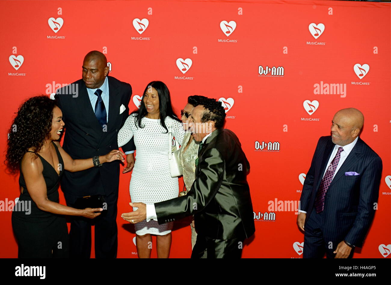 Angela Bassett, Magic Johnson, Earlitha Kelly, Frances Glandney, Smokey Robinson and Barry Gordy arrives for the 12th Annual MusiCares MAP Fund Tribute Concert at The Novo by Microsoft on May 19, 2016 in Los Angeles, California. Stock Photo