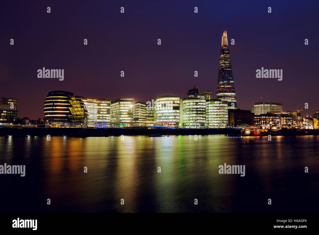 View over River Thames at night on city hall and Shard Stock Photo