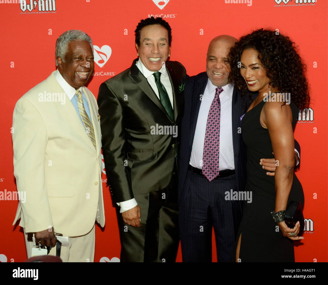 William 'Mickey' Stevenson, Smokey Robinson, Barry Gordy and Angela Bassett arrives for the 12th Annual MusiCares MAP Fund Tribute Concert at The Novo by Microsoft on May 19, 2016 in Los Angeles, California. Stock Photo
