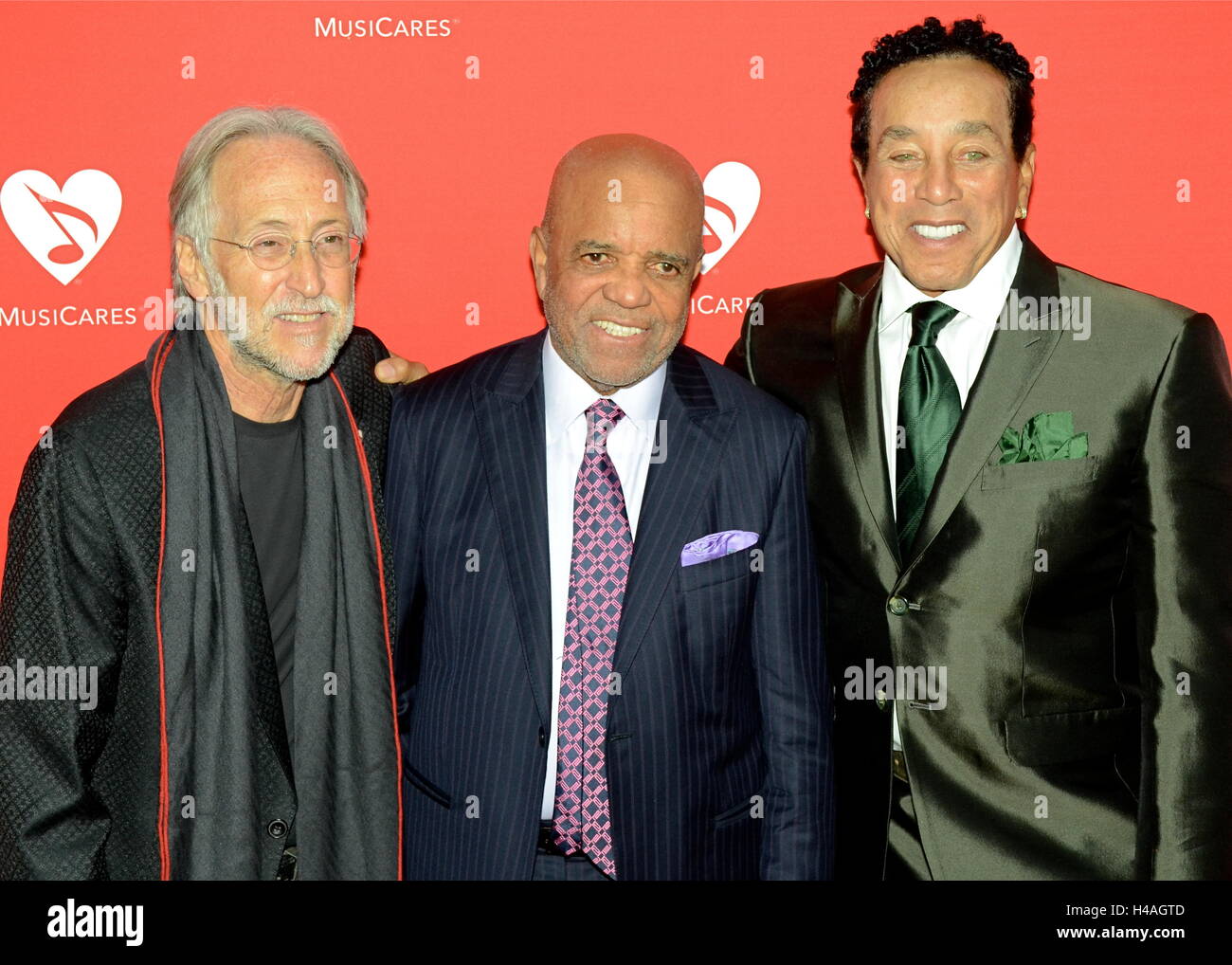 Neil Portnow, Barry Gordy andSmokey Robinson arrives for the 12th Annual MusiCares MAP Fund Tribute Concert at The Novo by Microsoft on May 19, 2016 in Los Angeles, California. Stock Photo