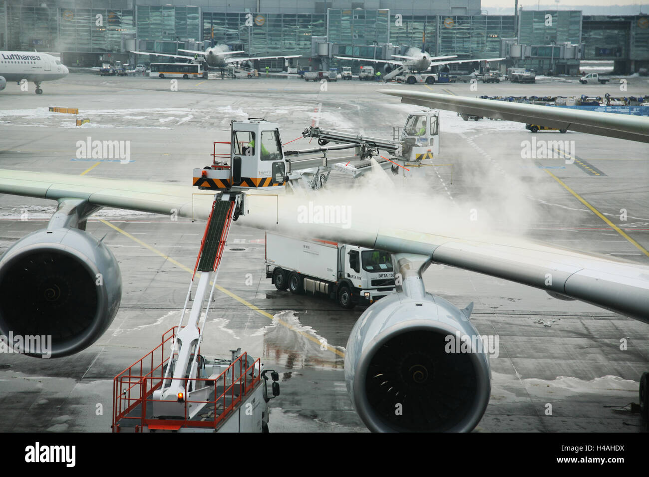 Airplane defrosting at the gate in the airport Frankfurt Stock Photo