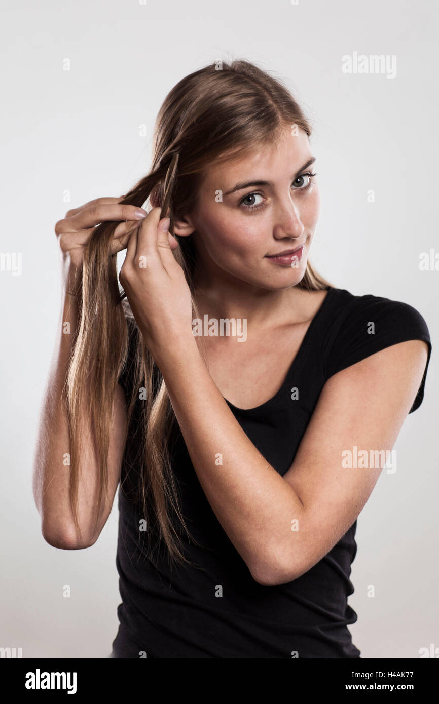 Instructions braided hairstyle with bun step 1 of 3 Stock Photo