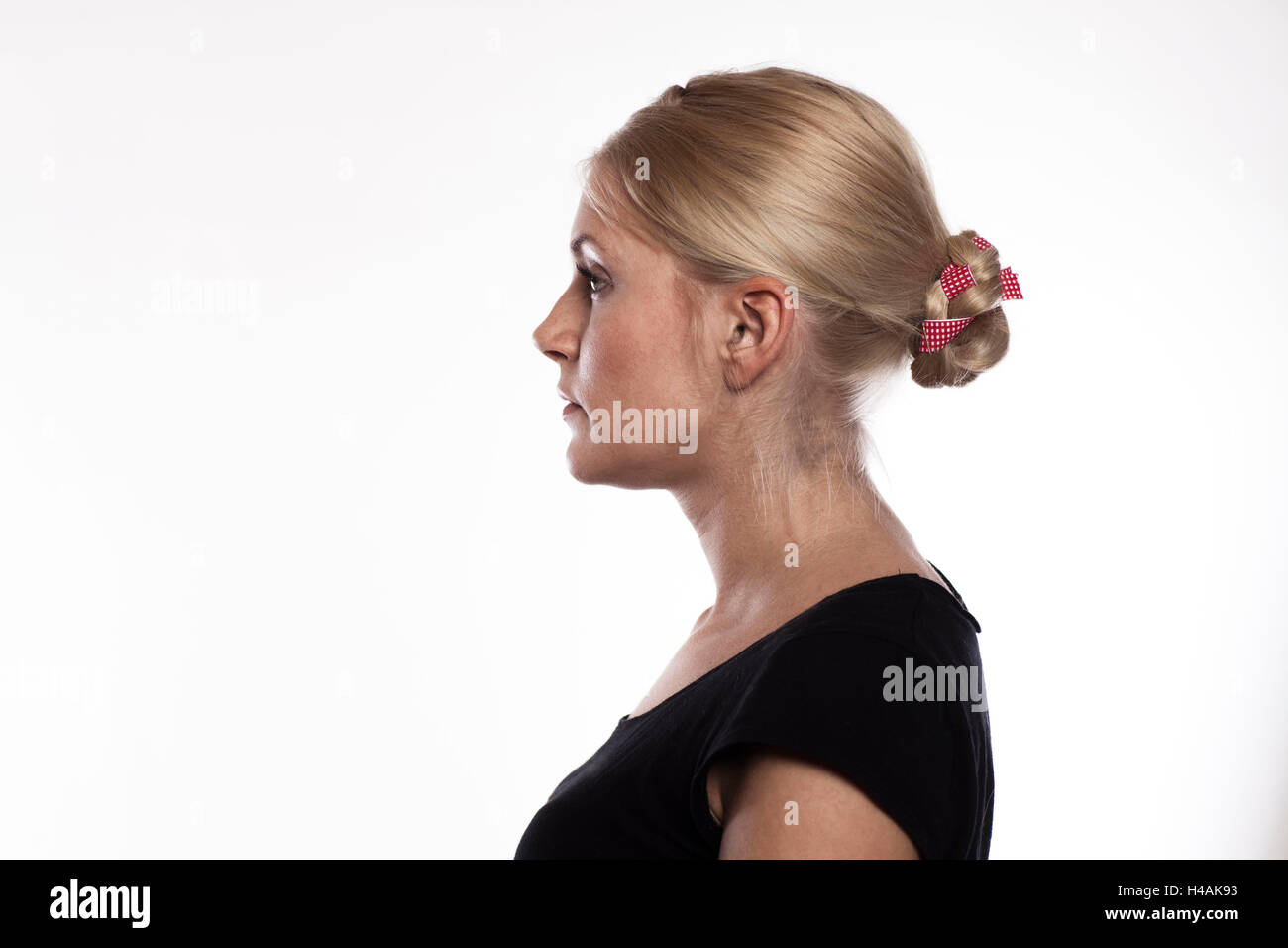 Bun with twisted plait and ribbon Stock Photo
