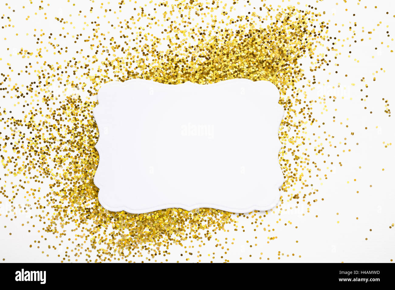 Luxury gold glitter sparkles frame on white with copy space for promotion Stock Photo