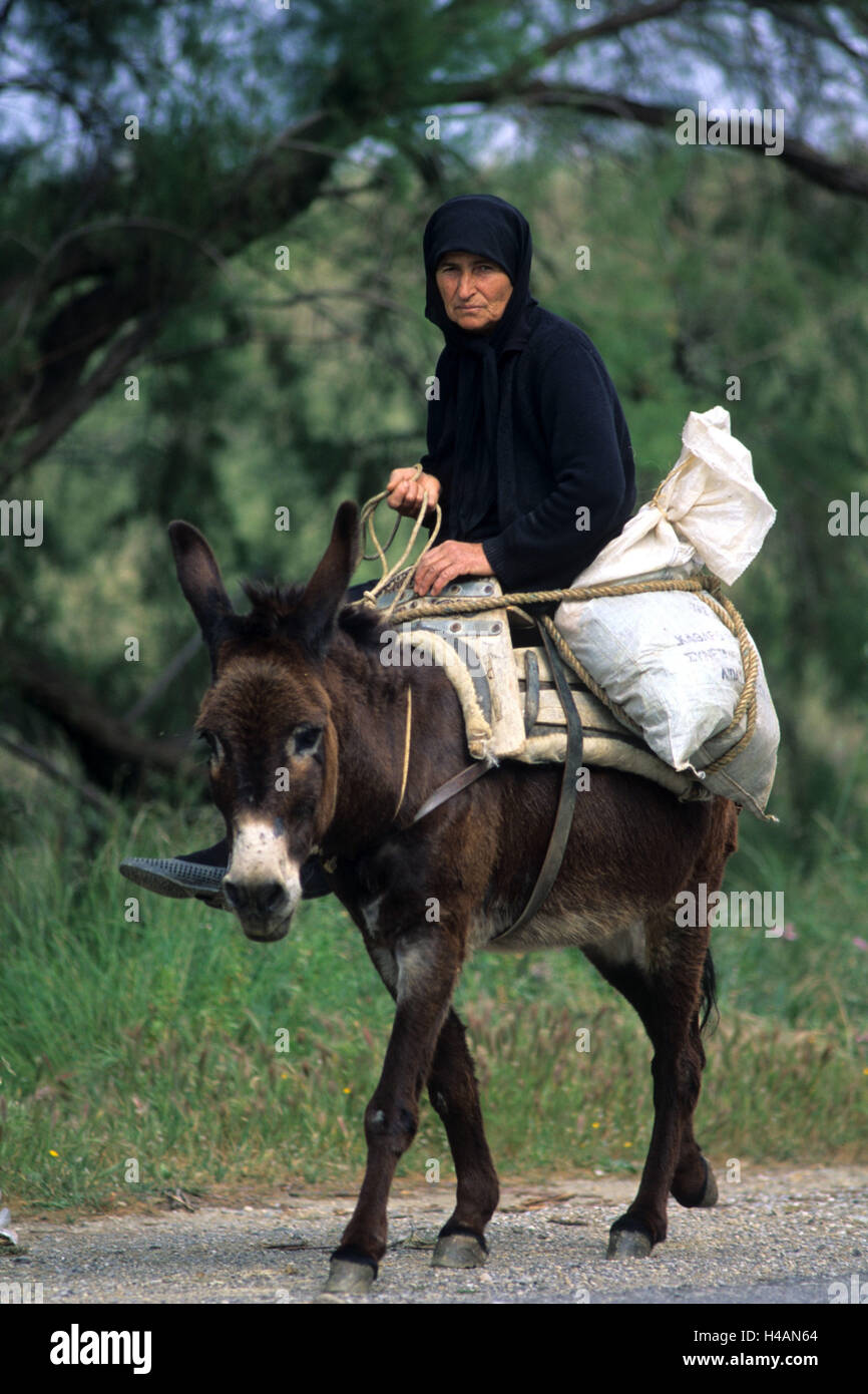 Greece, Crete, Fodele, woman on donkey Stock Photo - Alamy