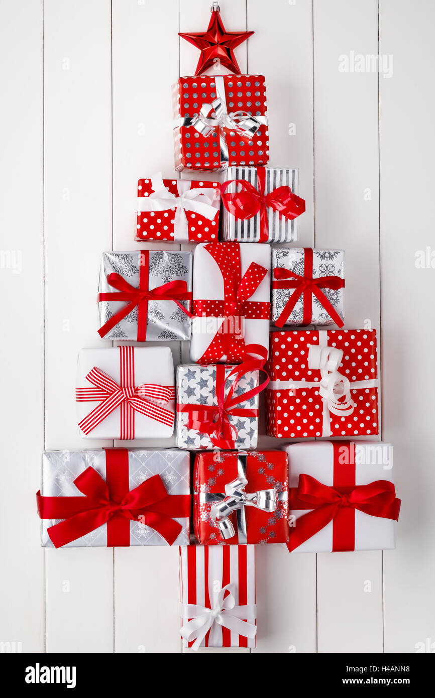 Christmas tree of gift boxes on wooden board Stock Photo