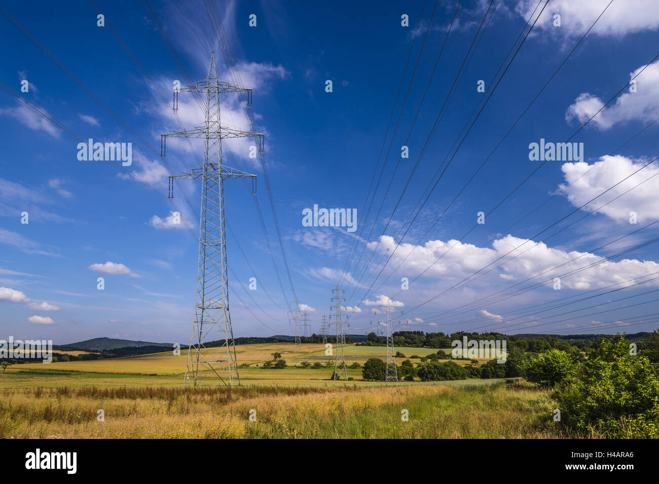 Germany, Hessen, Taunus, Niedernhausen, man-made landscape with high-voltage poles and high-tension circuits, Stock Photo