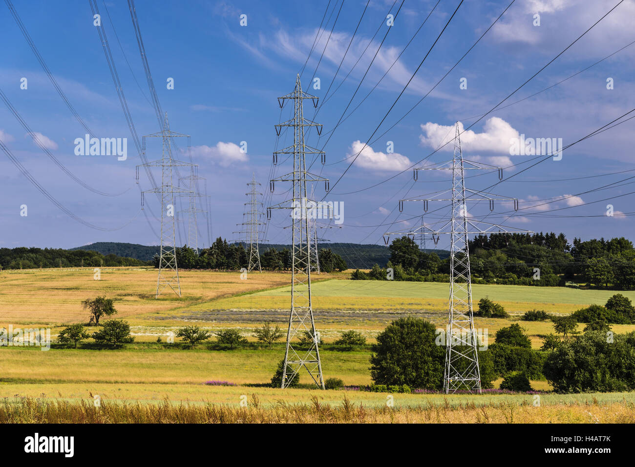 Germany, Hessen, Taunus, Niedernhausen, man-made landscape with high-voltage poles and high-tension circuits, Stock Photo