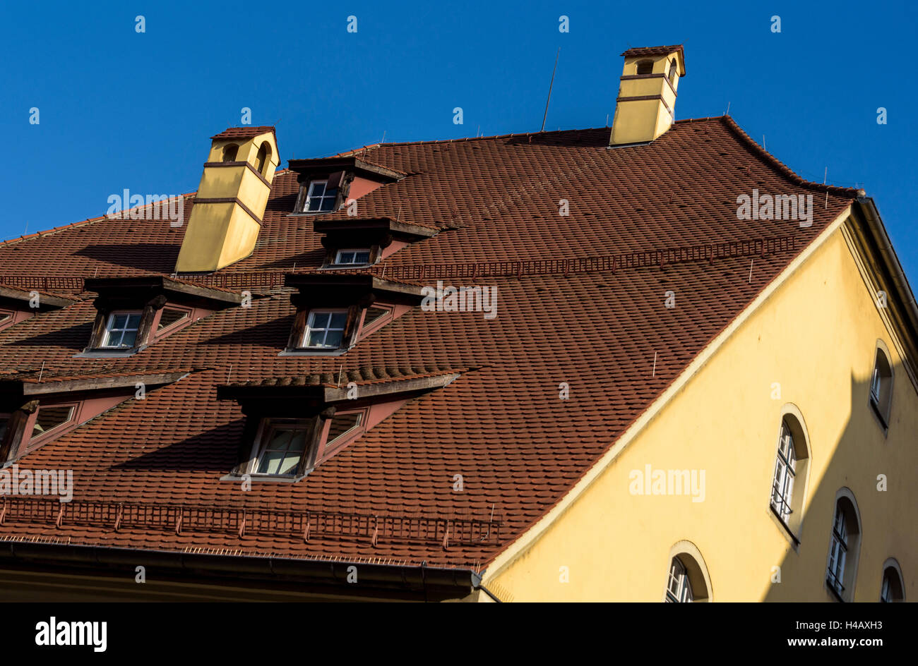 Steeply pitched roof.regensburg germany dormer windows Stock Photo