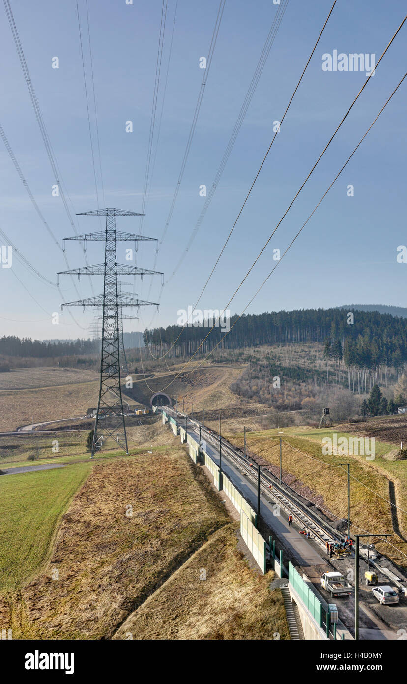 High-voltage poles, forest, tunnel, railroad line under construction, new stretch of track, Thuringian Forest Stock Photo