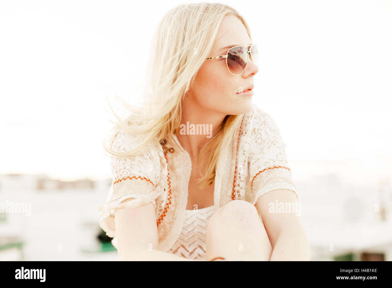 young woman in summer clothes on roof terrace Stock Photo