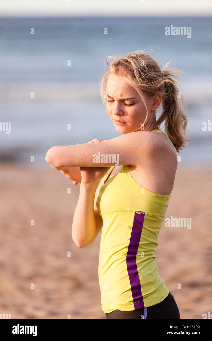 young woman, sports injury, arm pain Stock Photo Alamy