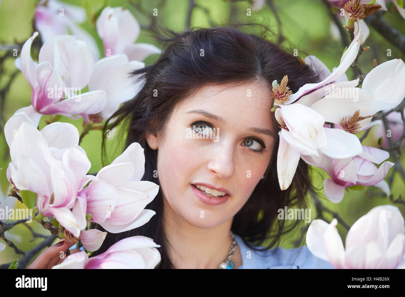 Woman, young, portrait, town park, spring, glancing sideways Stock Photo