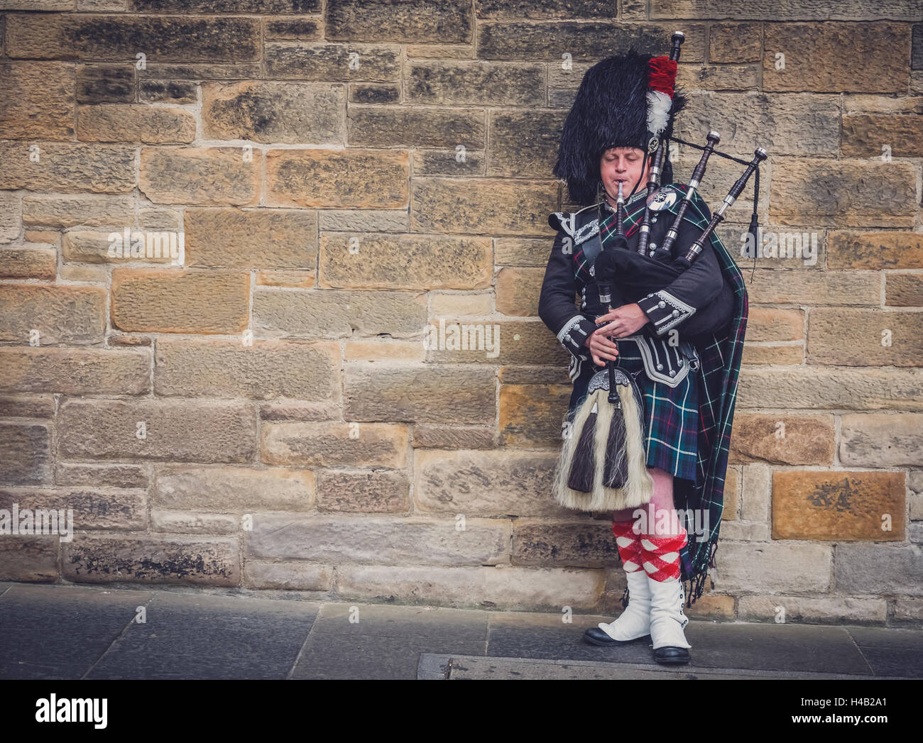 Edinburgh, Scotland -  02 September 2016 : Man playing traditional pipes on the streets of Edinburgh Stock Photo