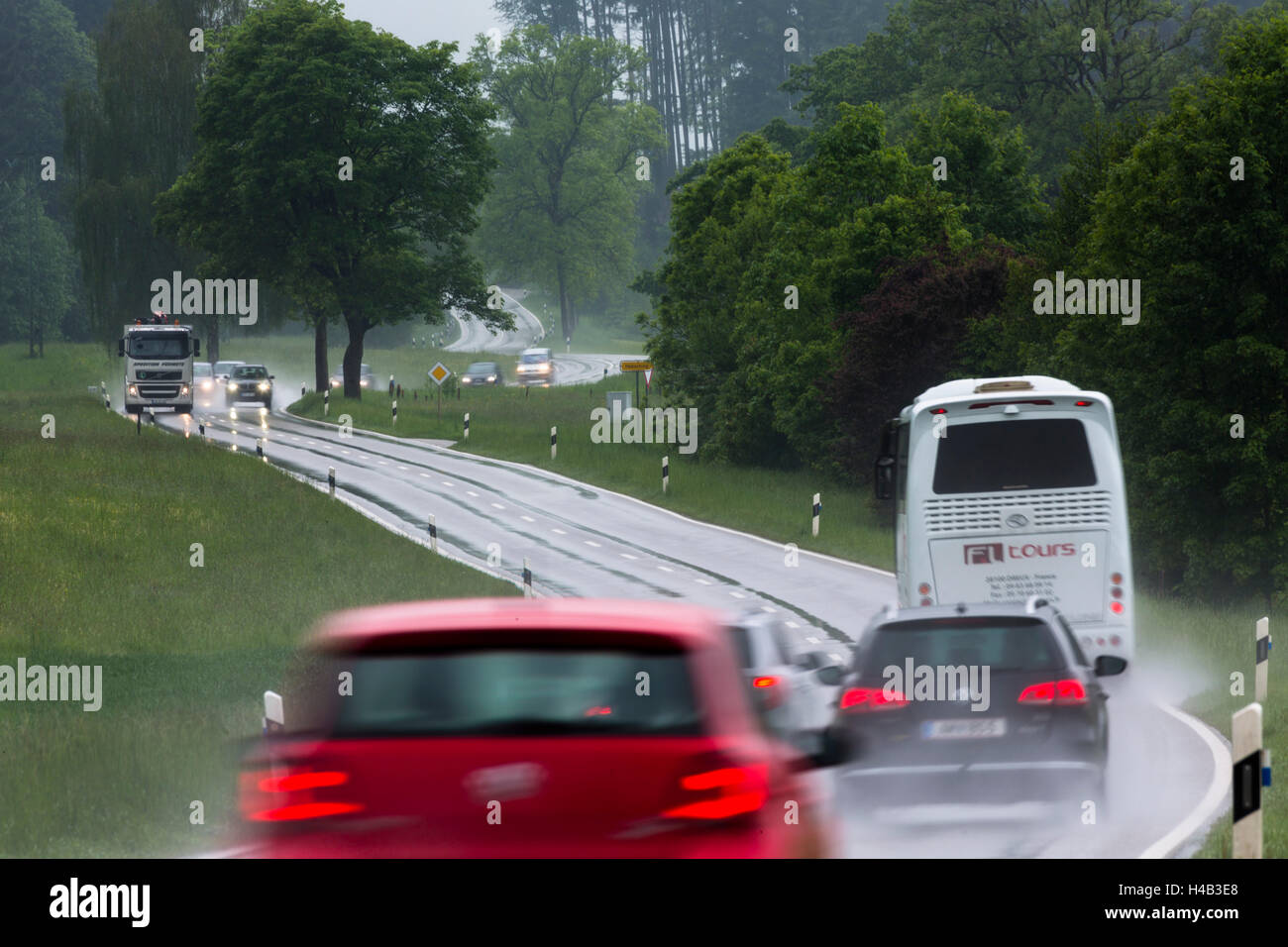 Germany, Bavaria, country road in the rain Stock Photo