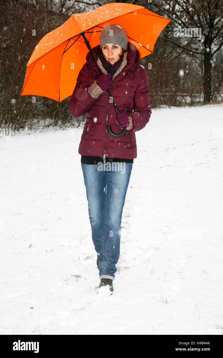 Woman, winter clothes, snow, umbrella Stock Photo