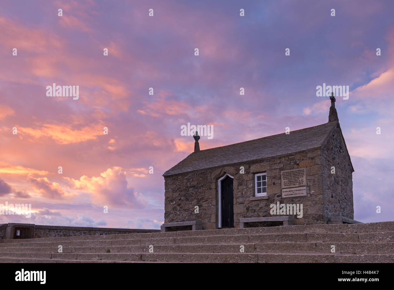 Beautiful sunset behind the Chapel of St Nicholas in St Ives, Cornwall, England. Winter 2013. Stock Photo