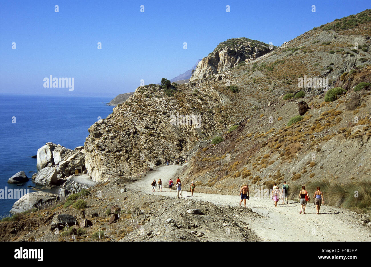 Greece, Dodekanes, island Fondling, cape agio Fokas, Embros Therme, mountain, way, pedestrian, sea, island group, Mediterranean island, the Aegean Sea, Embros-Thermen, coast, bile coast, sources, medicinal springs, thermal sources, thermal waters, place of interest, person, street, gravel road, footpath, scenery, scanty, tourists, tourism, Stock Photo