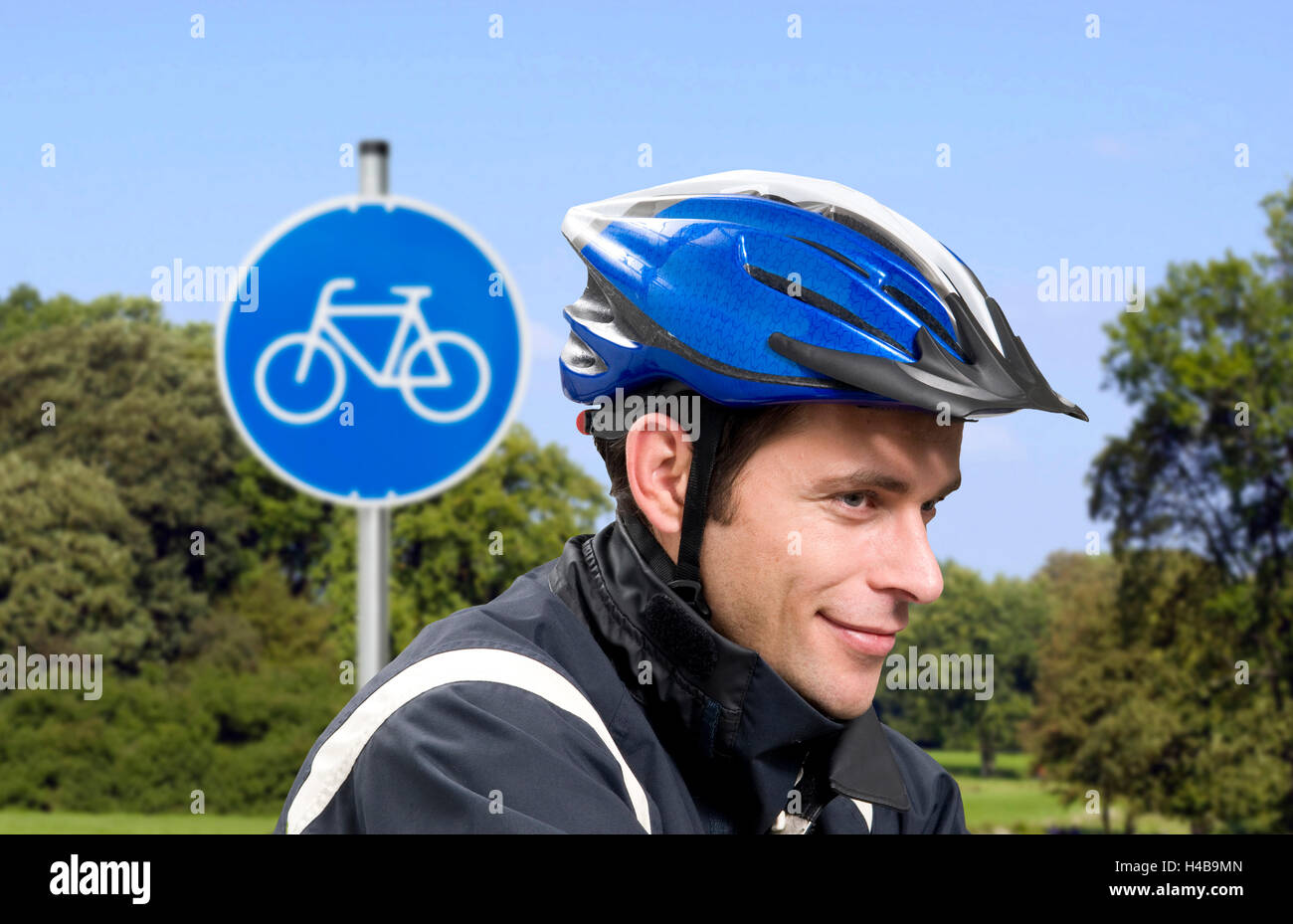 Man, bicycle helmet, riding a bike, sign, closeup Stock Photo Alamy