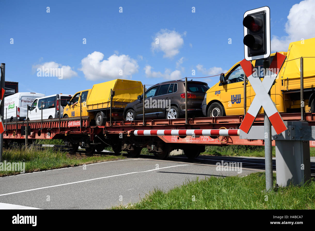 Railroad crossing, car train, Sylt Shuttle, connecting the island of Sylt with the mainland, Sylt, North Frisian Islands Stock Photo