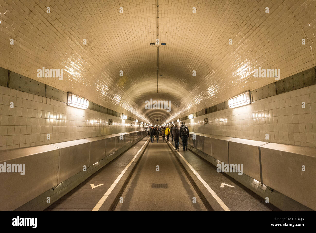 Pedestrians walk through the old Elbe tunnel, Hamburg, Germany Stock
