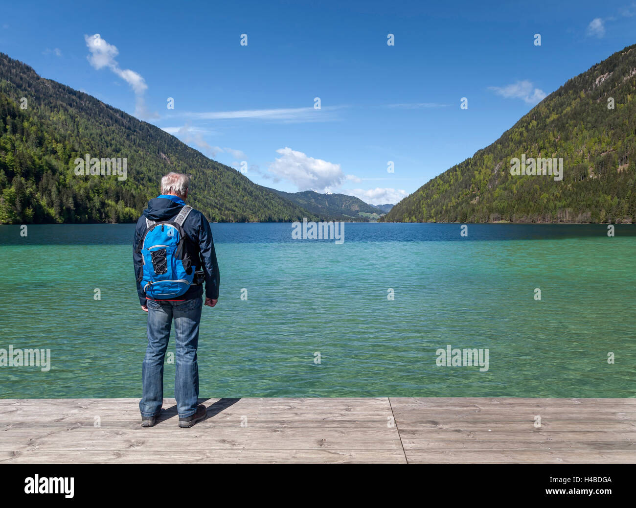 Hiker at the Weissensee Stock Photo