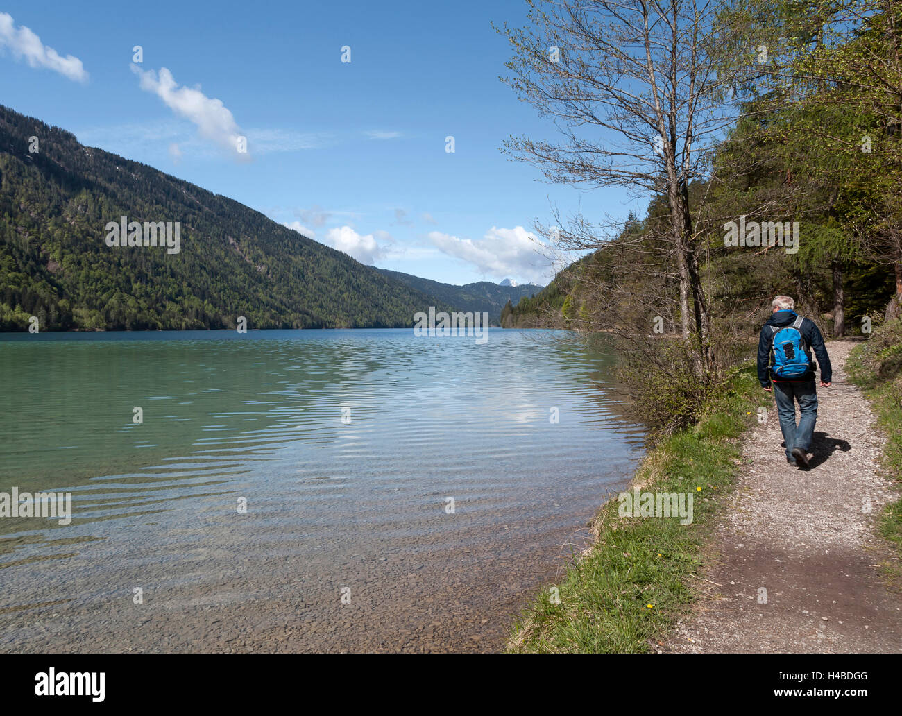 Hiker at the Weissensee Stock Photo
