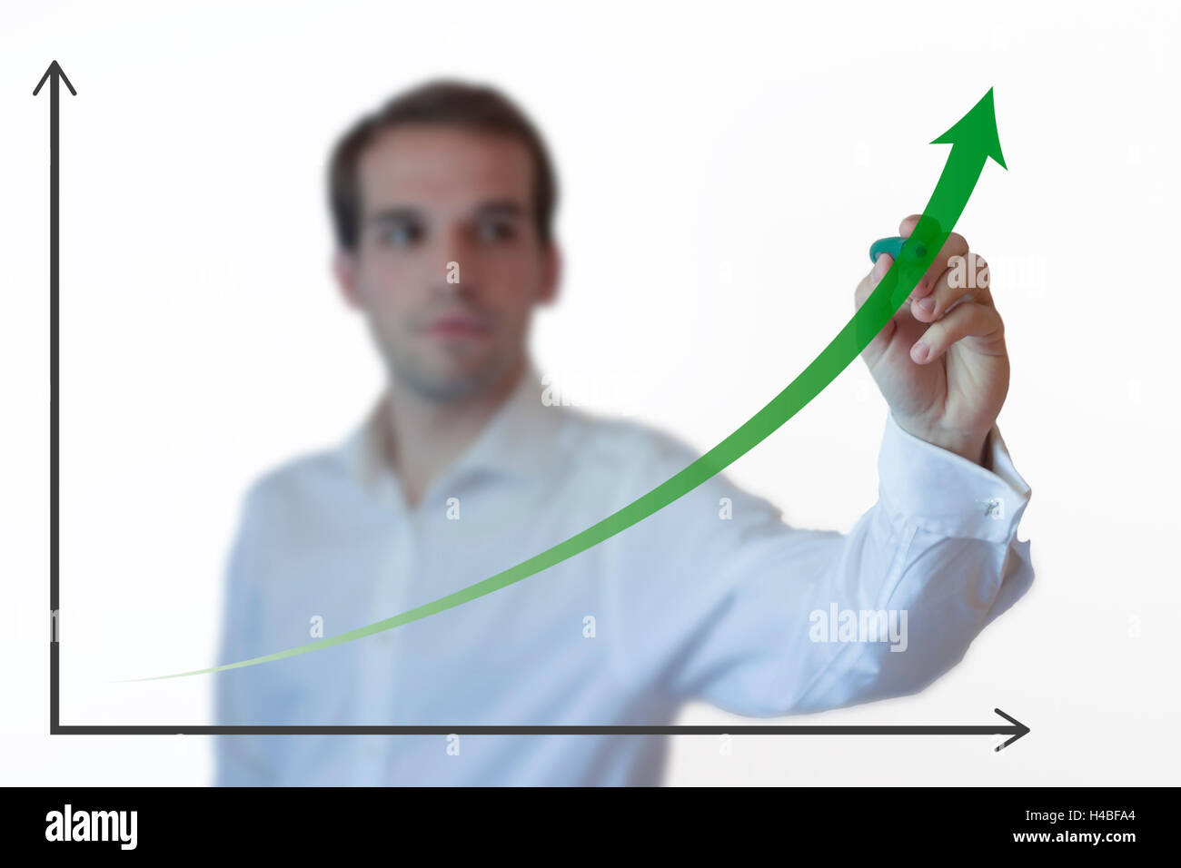 Businessman presenting a successful sustainable development on a bar chart Stock Photo