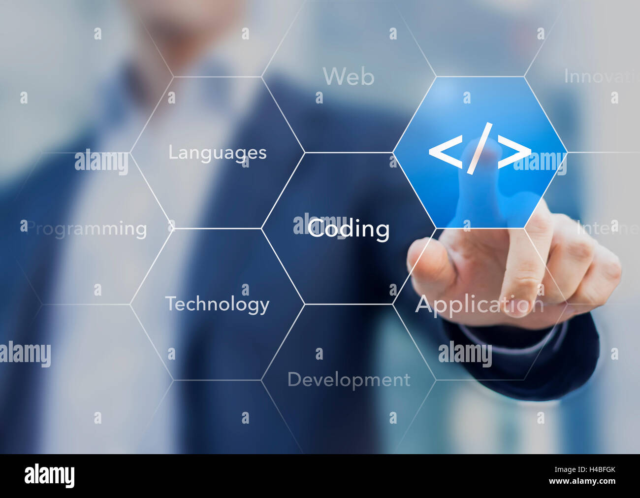 Coding symbol on virtual screen about developing apps or websites Stock Photo