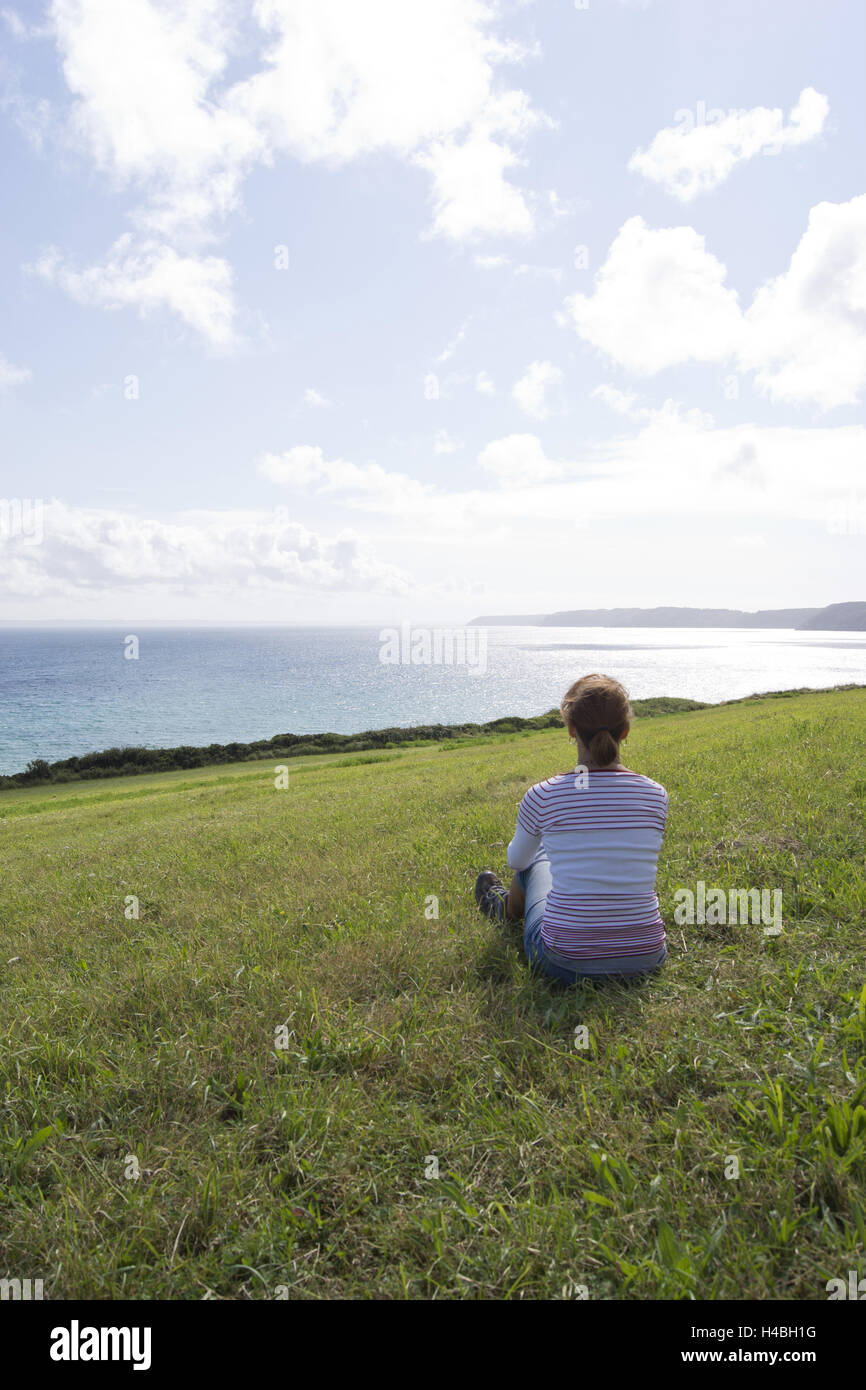 Woman while taking it easy by the sea, Stock Photo