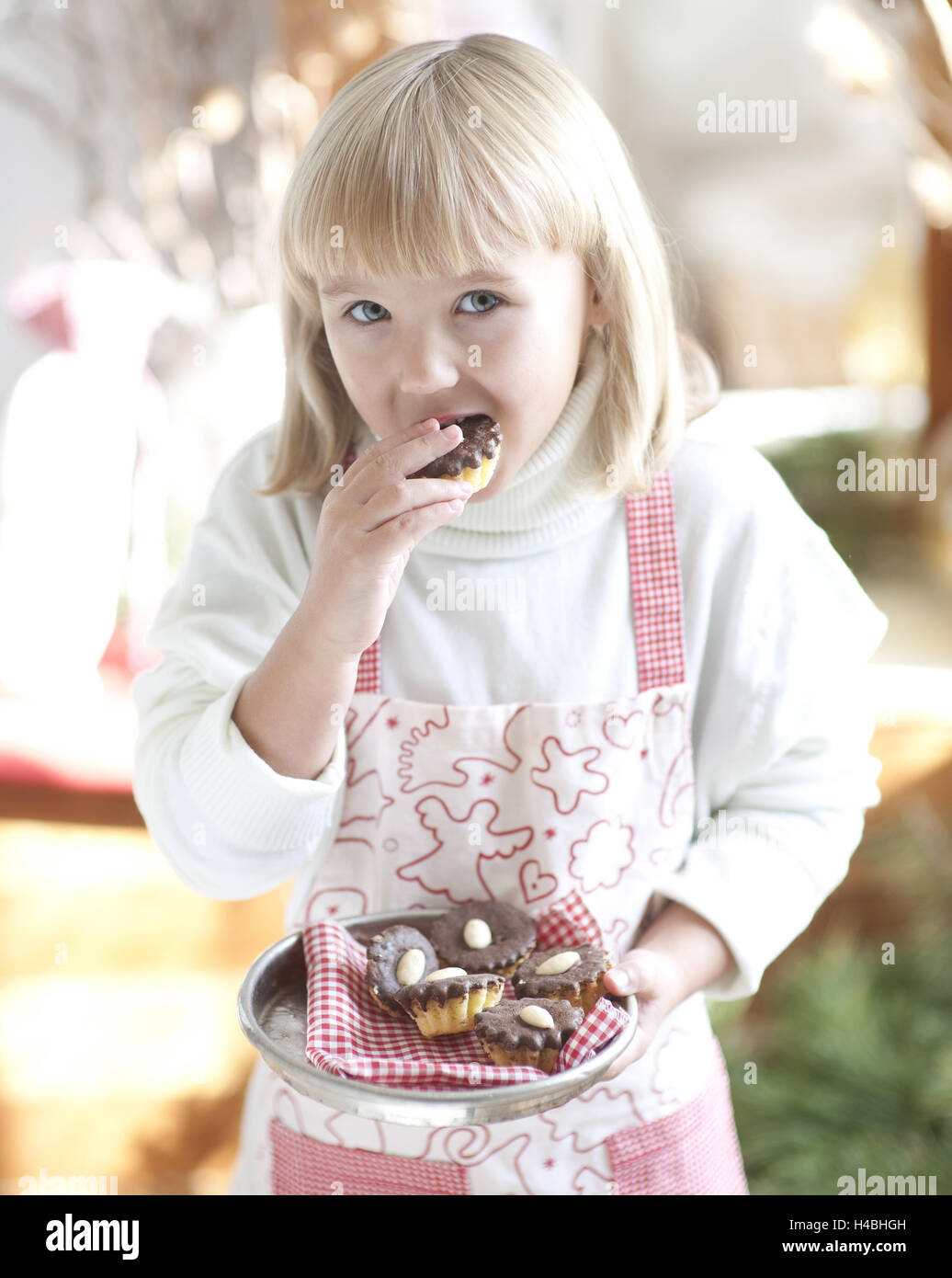 Girl, eating cookie, half portrait, Stock Photo