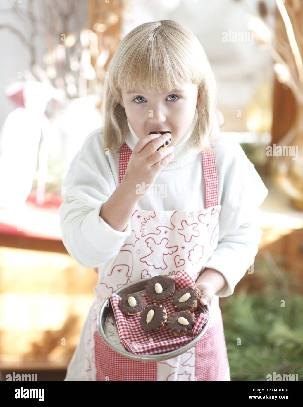 Girl, eating cookie, half portrait, Stock Photo