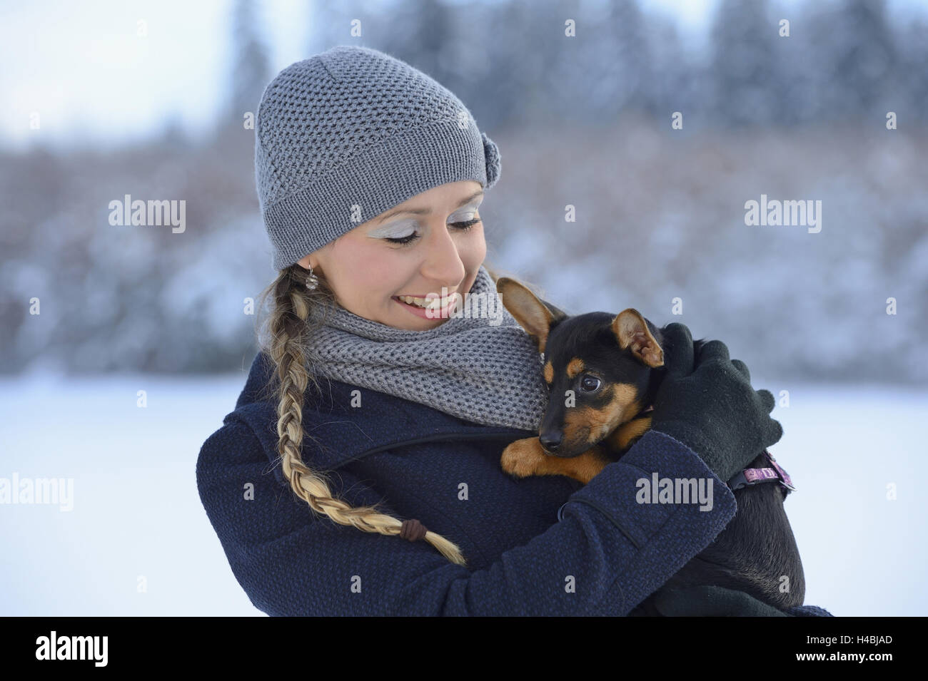 Young woman, dog puppy, carry Stock Photo Alamy