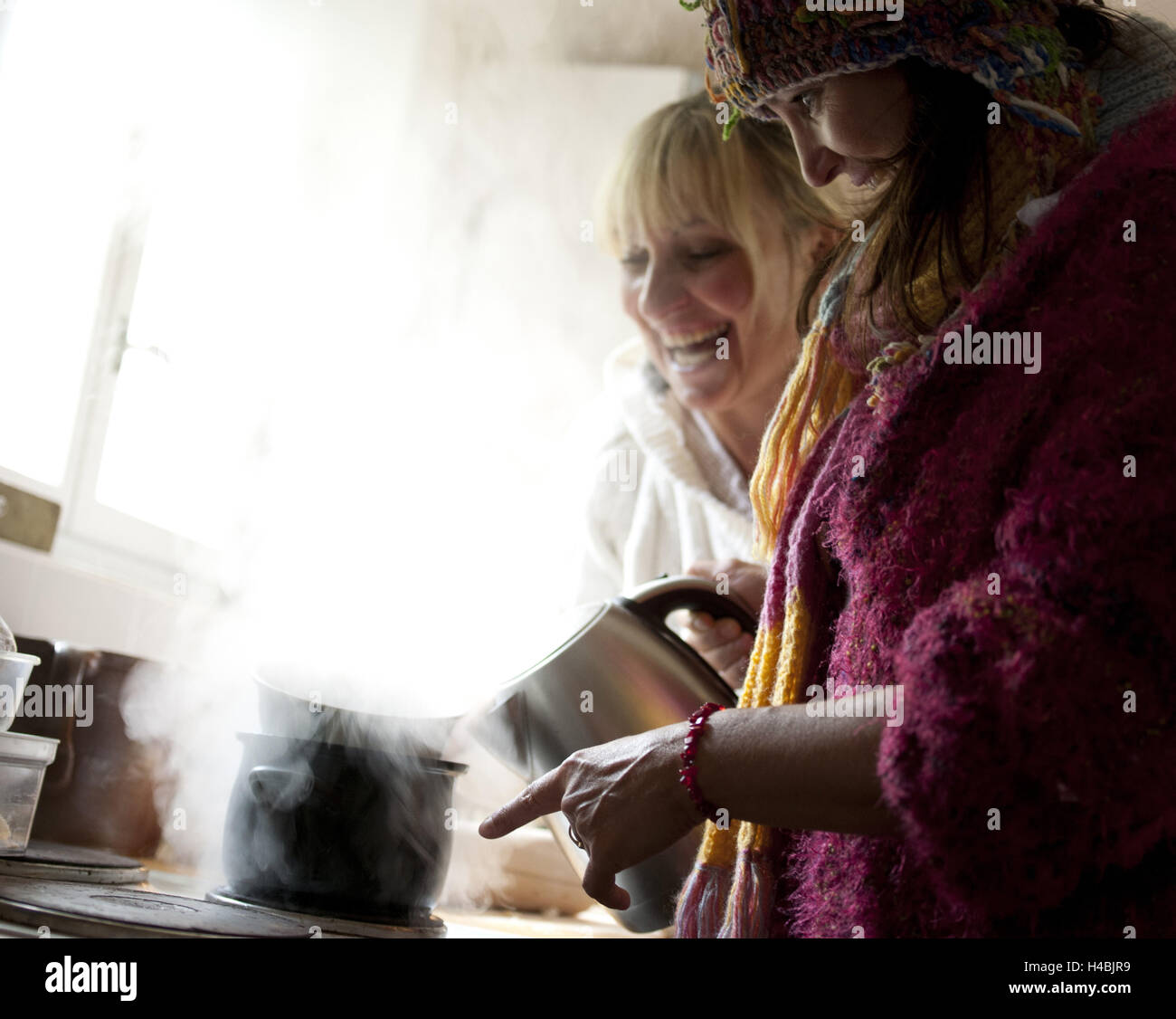 Two women, cuisine, tea prepare, happily, laugh, Stock Photo