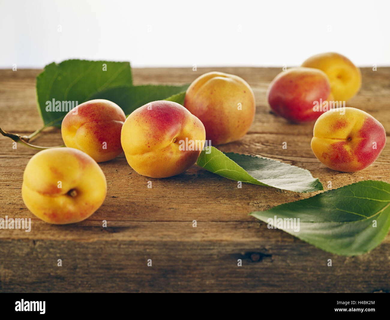 Apricots, yellow, red, wooden table, harvest, autumn, fall Stock Photo