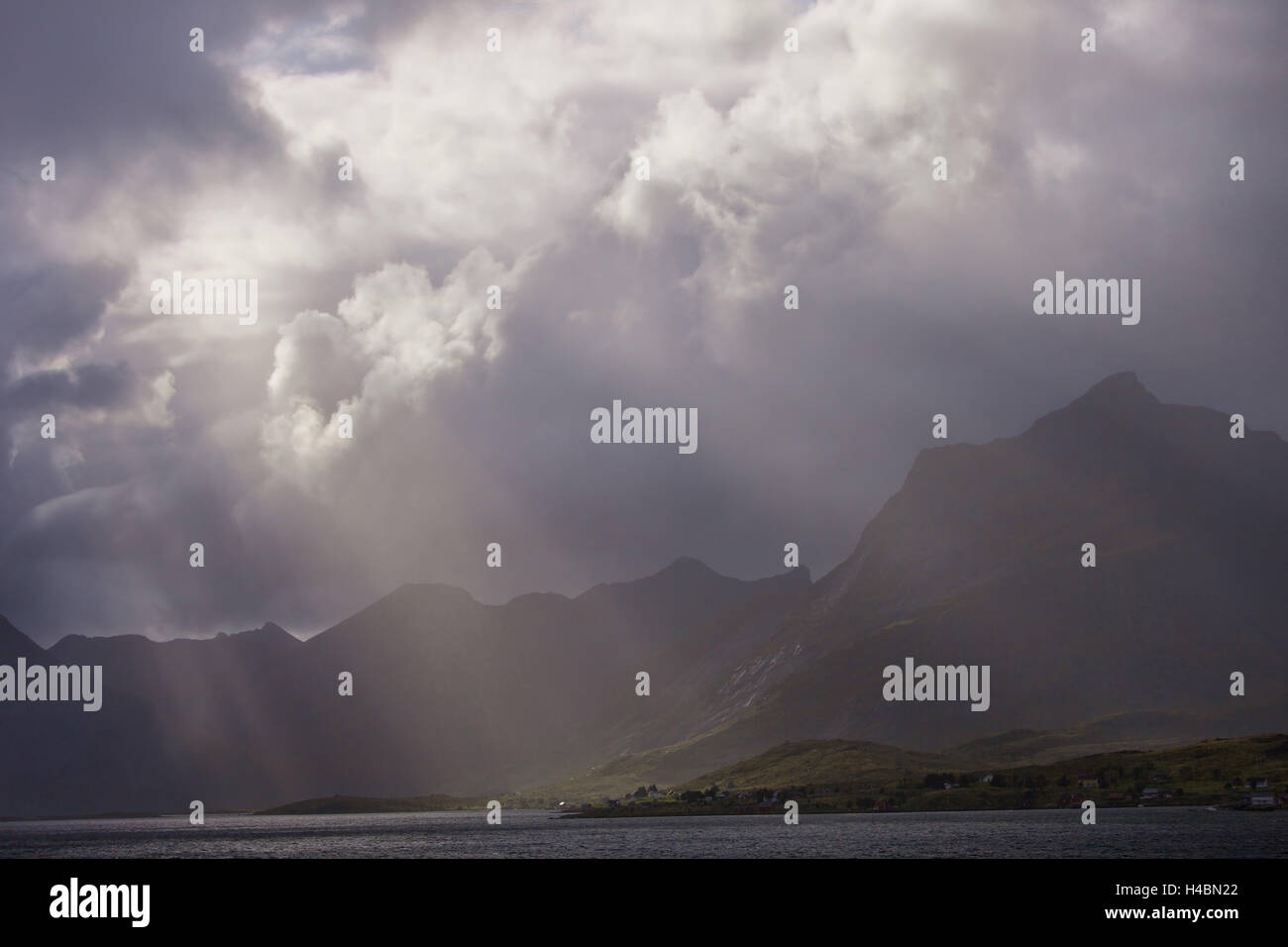 Storm, sunrays, light, clouds, shores, Selfjorden, fjord, mountains, Lofoten, Norway Stock Photo