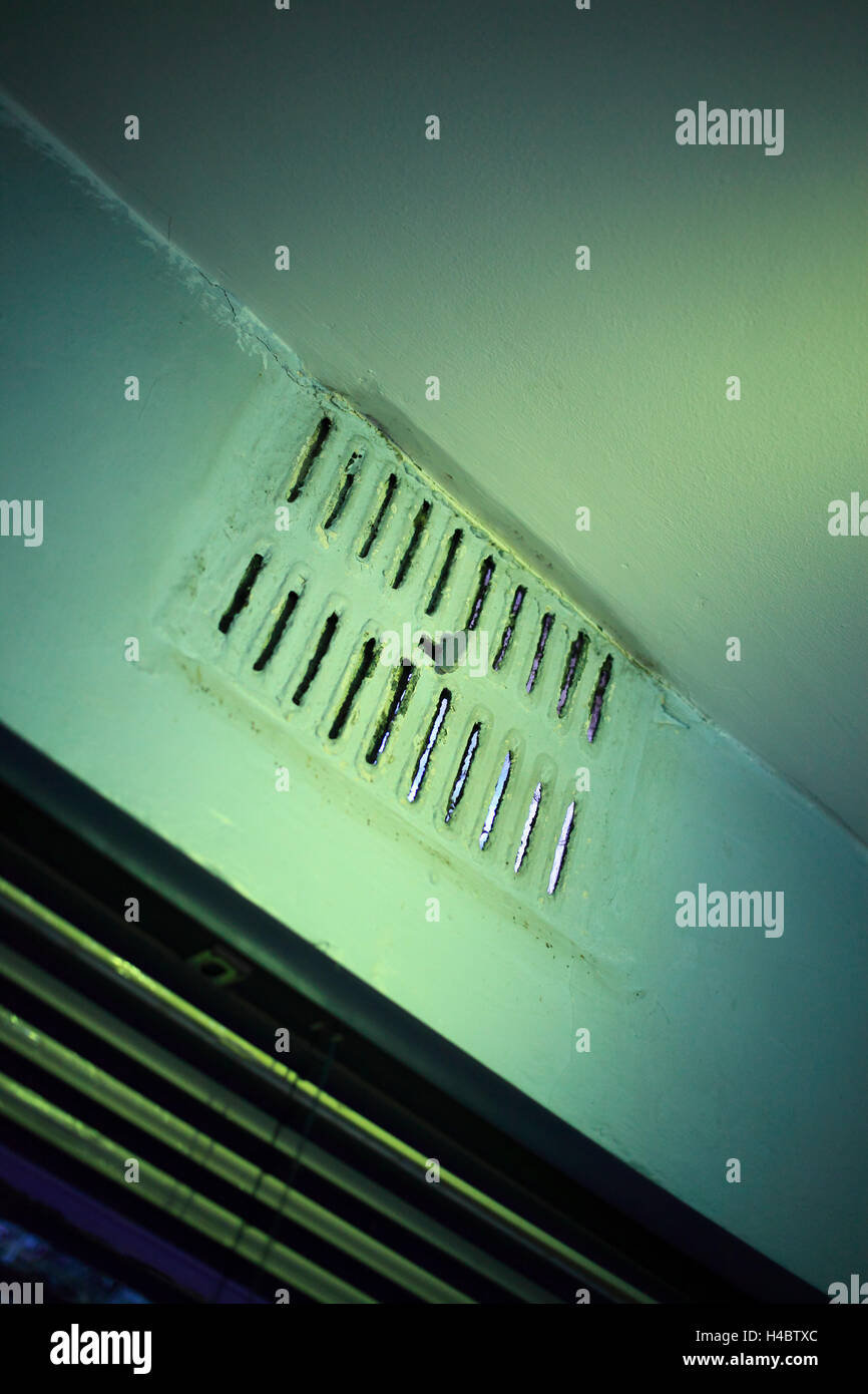 Dirty old air vent in a downstairs toilet. Stock Photo