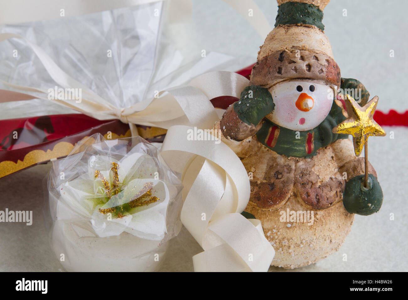 Christmas snowman with wrapped candle Stock Photo