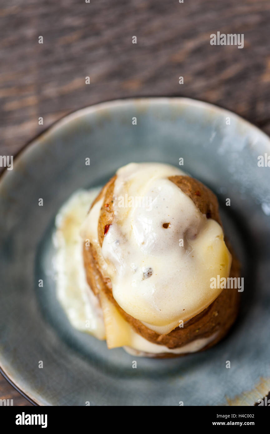Baked potato with cheese Stock Photo - Alamy