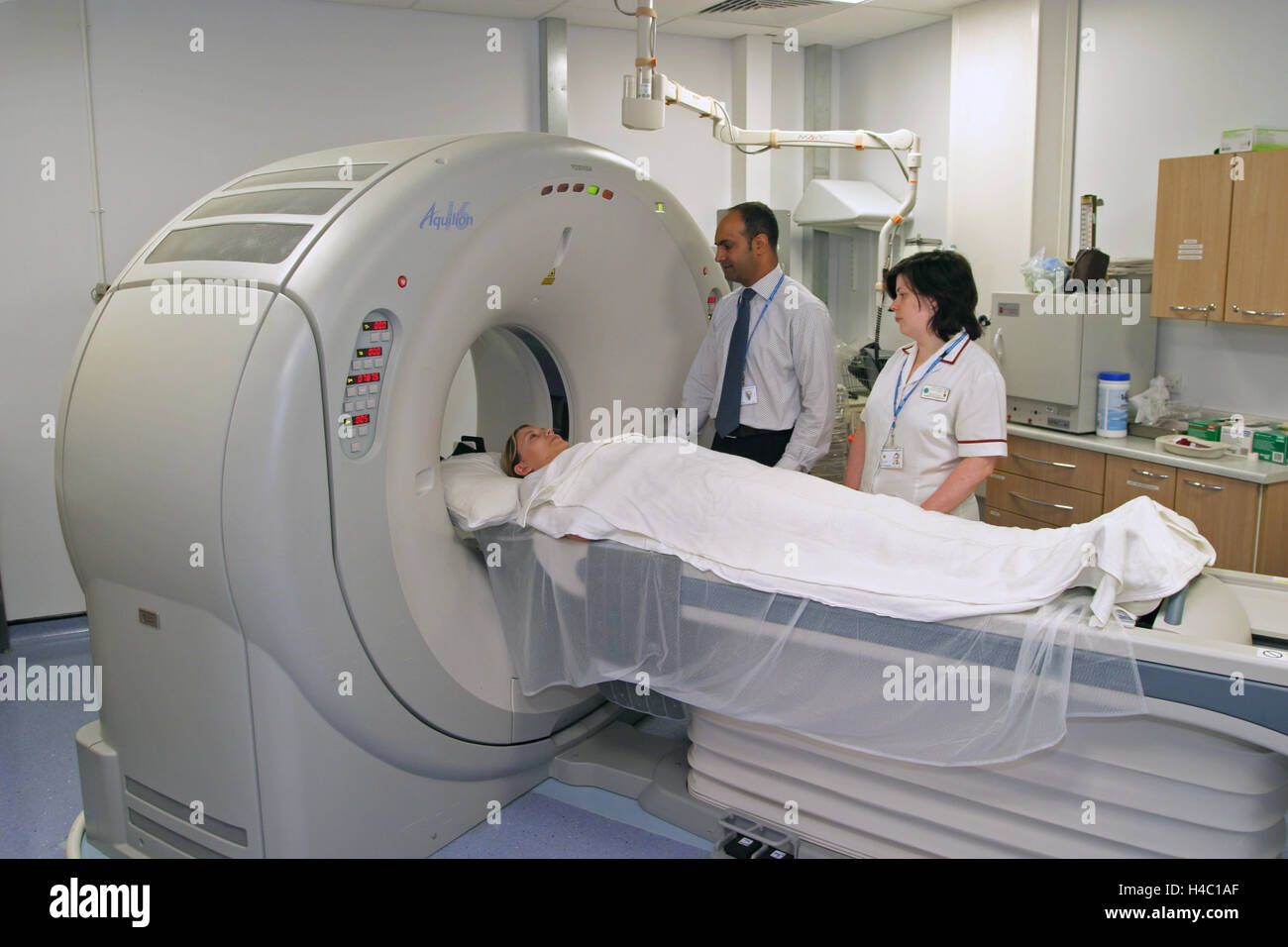 A patient (posed by hospital staff) is prepared to be examined in an MRI scanner in a new West London hospital Stock Photo